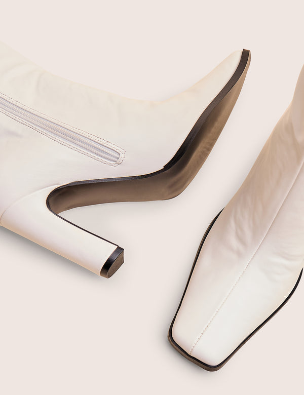 Acquilla White Knee High Flared Boots