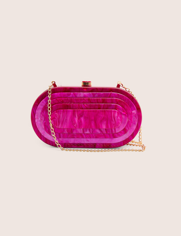 The Cleo Marble Resin Oval Clutch Bag in Pink