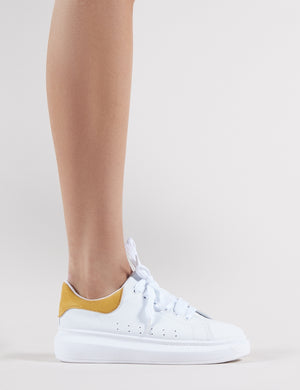 Bolt Platform Trainers in White and Yellow Public Desire