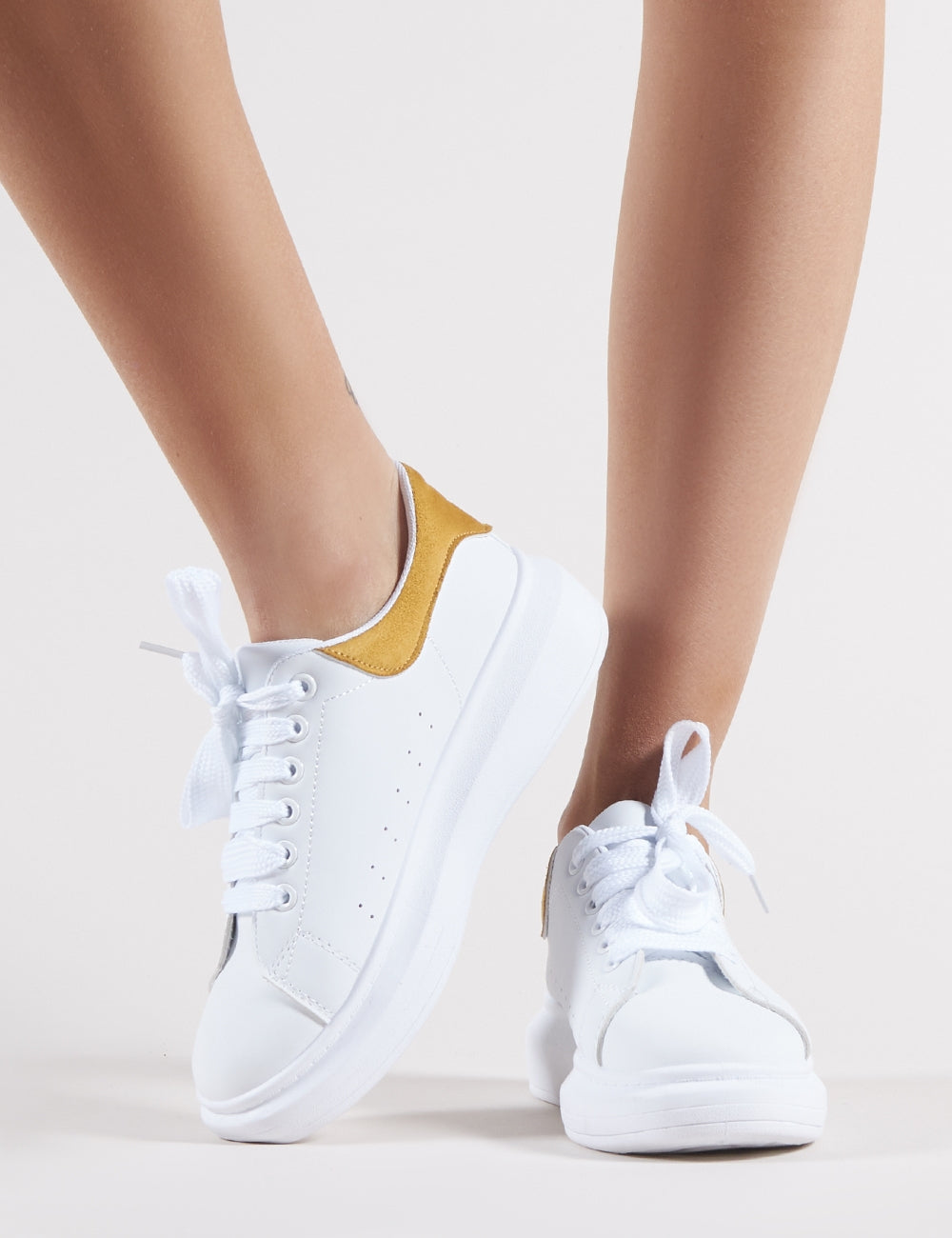 Bolt Platform Trainers in White and Yellow Public Desire